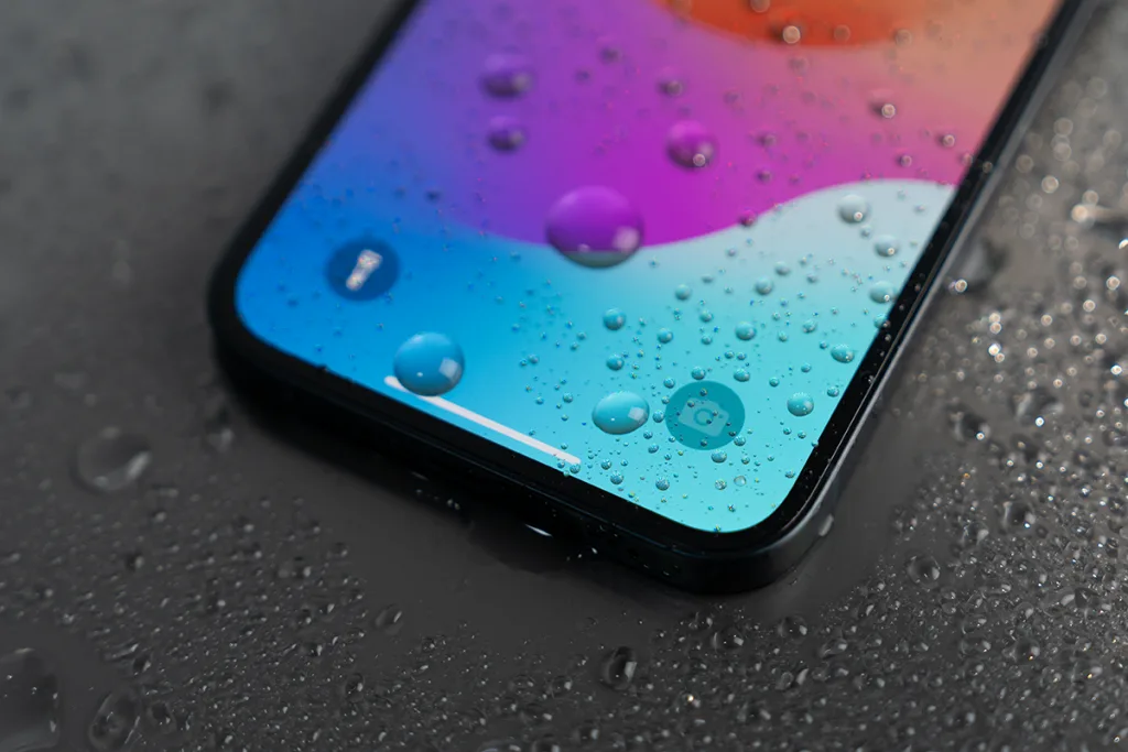 iPhone 16 screen covered with water droplets